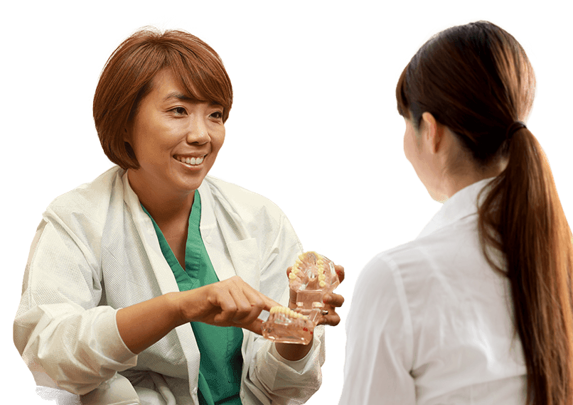 Dr. Kim showing patient a smile model
