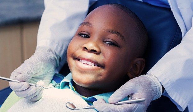 Smiling boy in dental chair