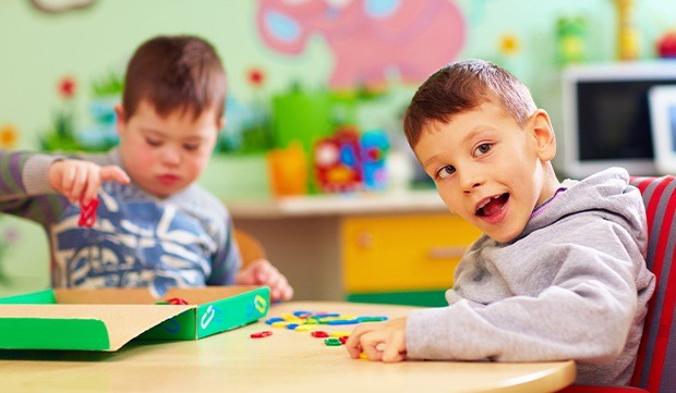 Two boys at school table