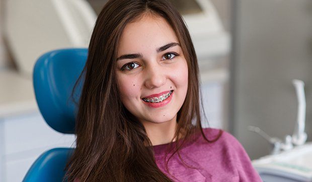 Woman with braces in dental chair