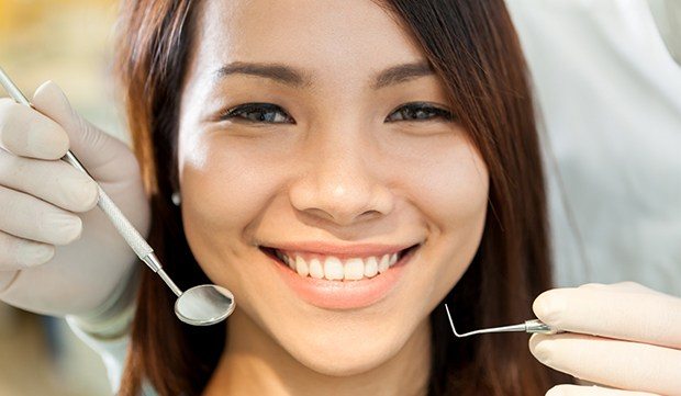 Woman receiving dental exam