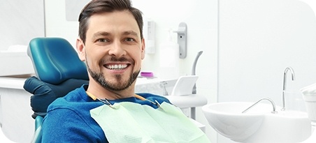 Smiling man in dental chair