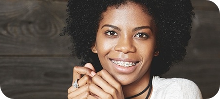 Woman with braces smiling