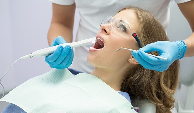 Dentist capturing intraoral images